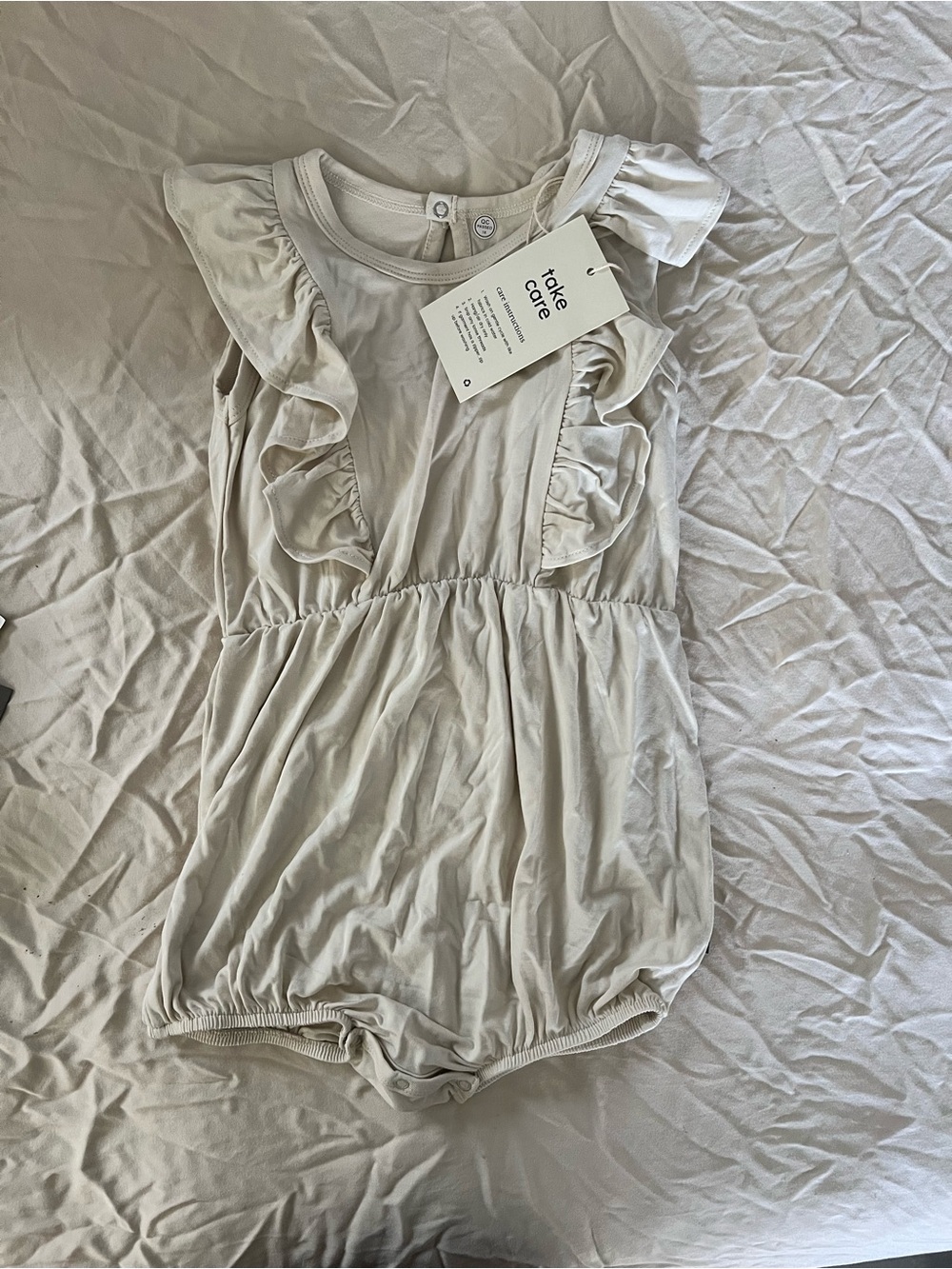 Kyte Baby Cream Ruffle Baby Romper